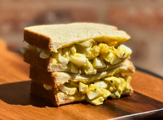 image of egg salad sandwich made with Bravado Spice Creamy Herb & Jalapeño Hot Sauce.