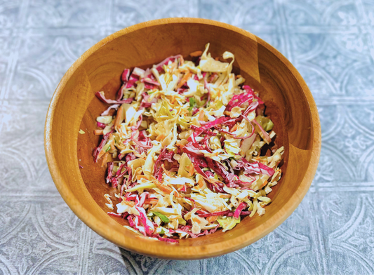 photo of coleslaw with bravado spice ghost pepper blueberry hot sauce