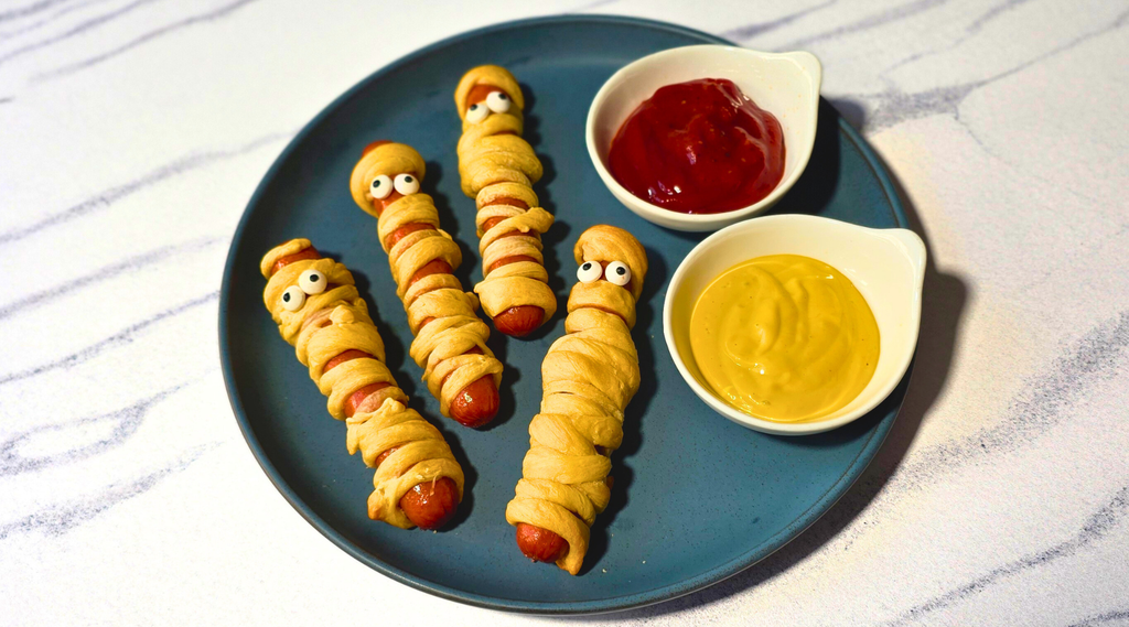 photo of mummy dogs with spicy ketchup and spicy mustard dipping sauce