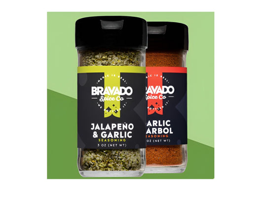 Two shake bottles of Jalapeno & Garlic and Garlic & Arbol all-purpose seasonings from Bravado Spice Co.
