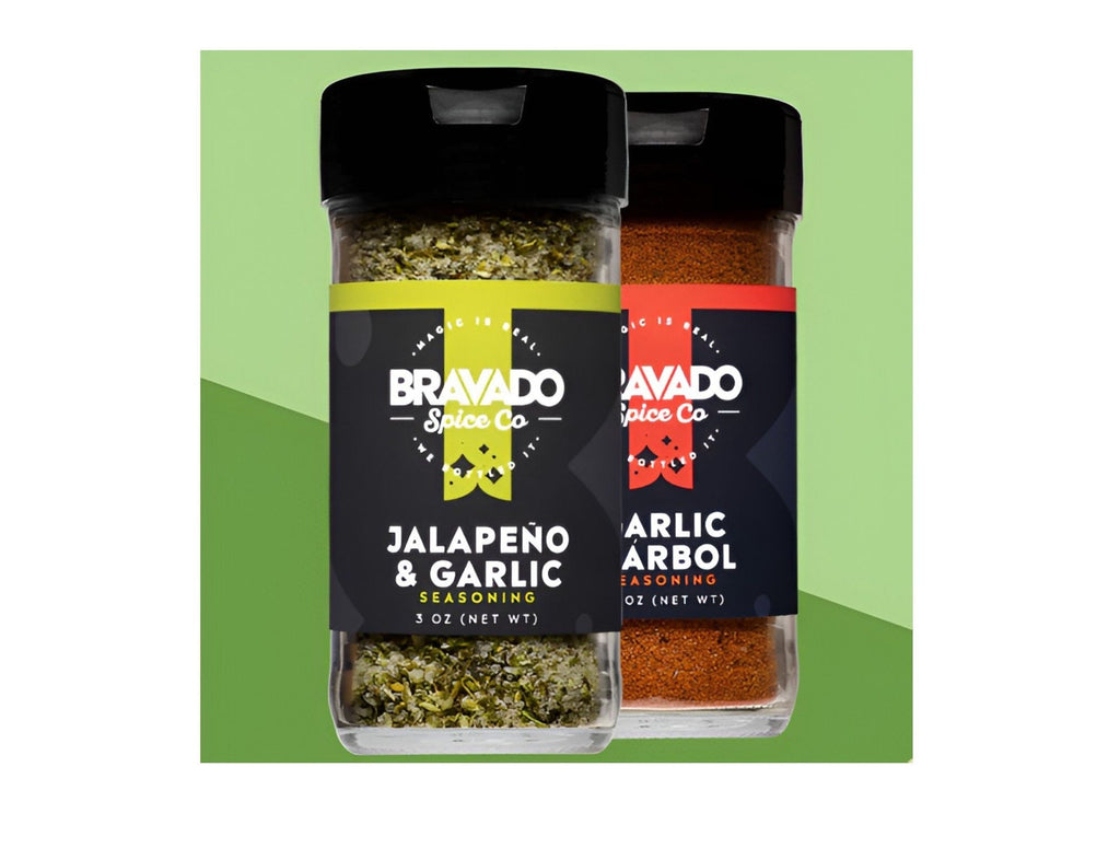 Two shake bottles of Jalapeno & Garlic and Garlic & Arbol all-purpose seasonings from Bravado Spice Co.