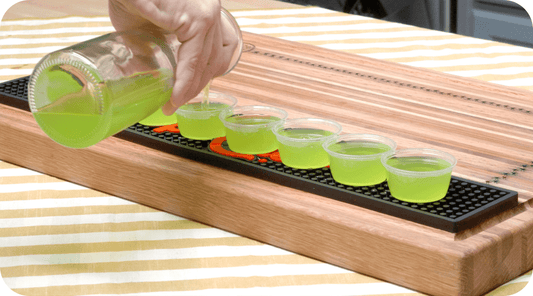 margarita jello shots being poured into cups