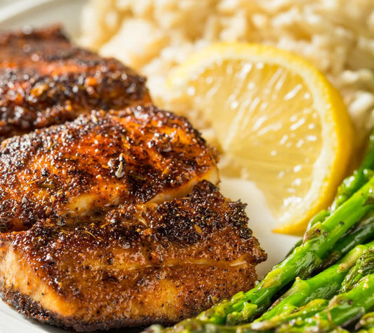 Blackened salmon with asparagus, seasoned with Cajun-inspired Garlic & Árbol Seasoning by Bravado Spice Co.