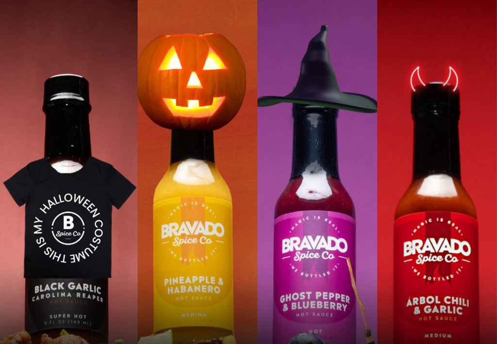Four unique flavor bottles of Bravado Spice Co.’s hot sauces in Halloween costumes.