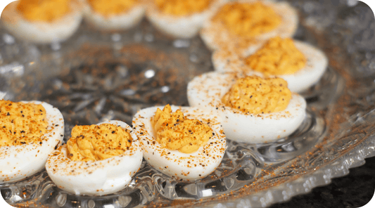 tray of spicy deviled eggs in a row
