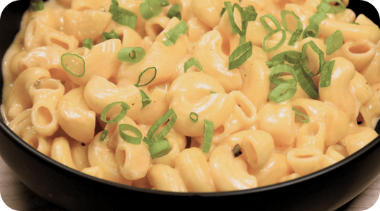stovetop mac and cheese with chives garnish 