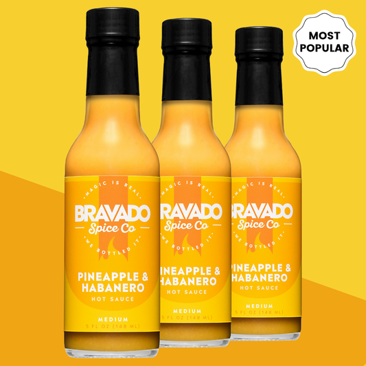 Bravado Spice Co Pineapple & Habanero Hot Sauce labeled "Most Popular" and "Medium" - tropical pineapple habanero sauce in 5 oz bottles.
